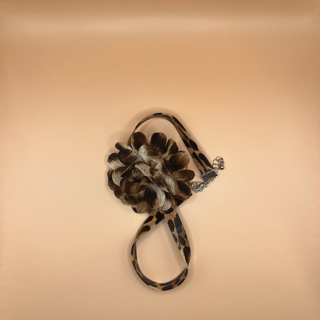 chocker with a camouflage pattern on a beige background