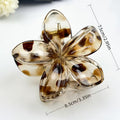 Flower-shaped hair clip with leopard print pattern and measurements on a white background