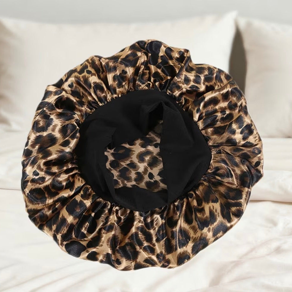 Leopard print bonnett on a bed