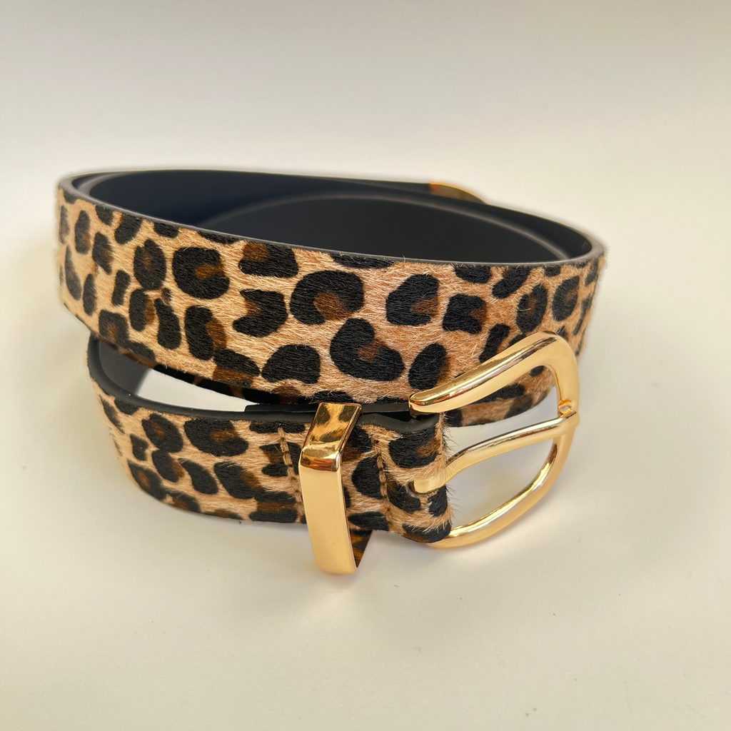 Leopard print belt with a gold buckle on a light gray background