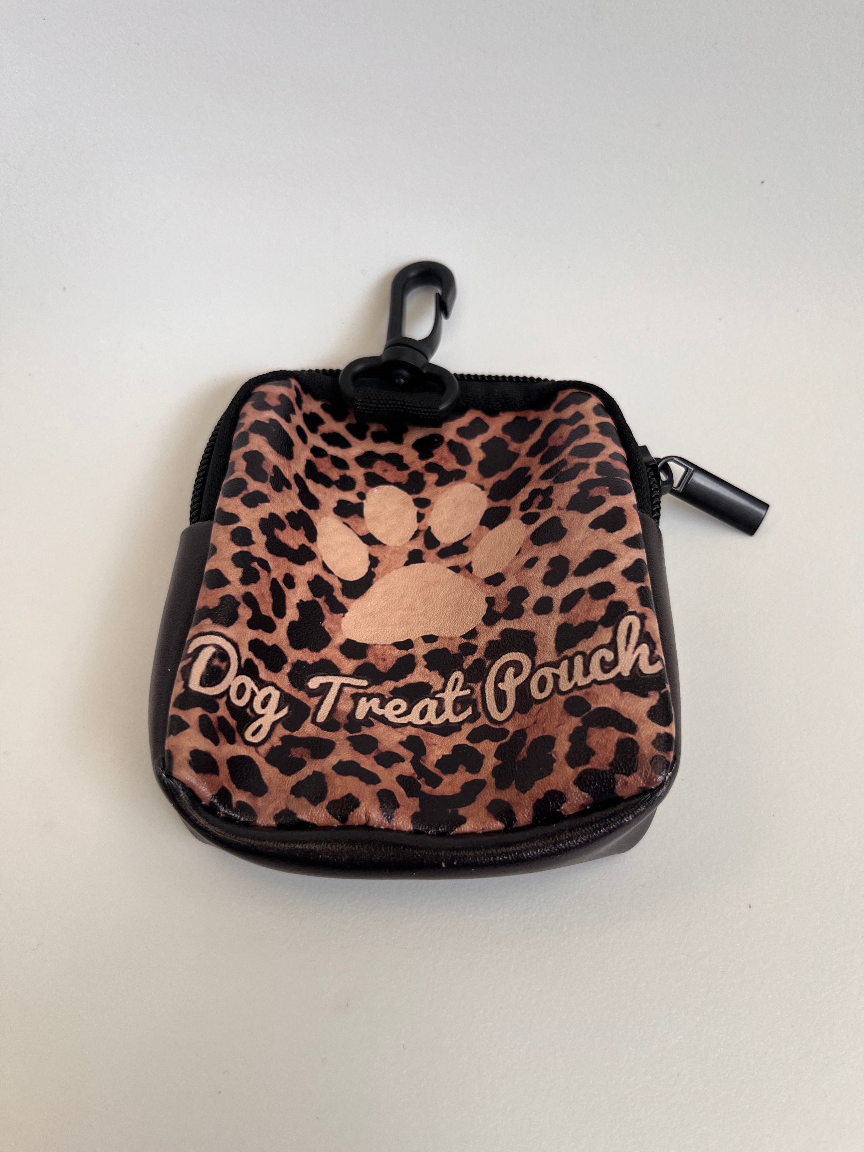 Leopard print dog treat pouch with a paw design on a white background