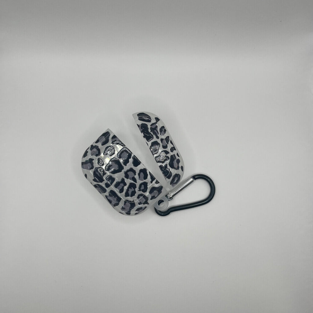 Leopard print earbud cases on a light gray background