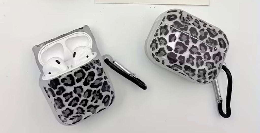 Two leopard print AirPod cases on a white background