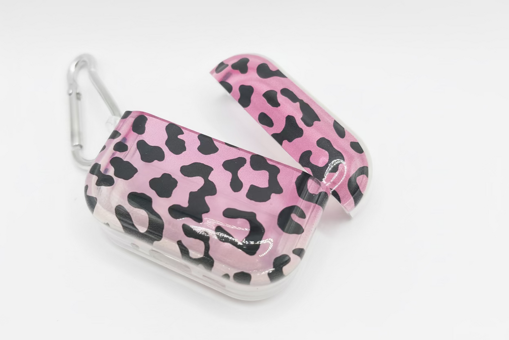 Pink case with black leopard print and carabiner on a white background
