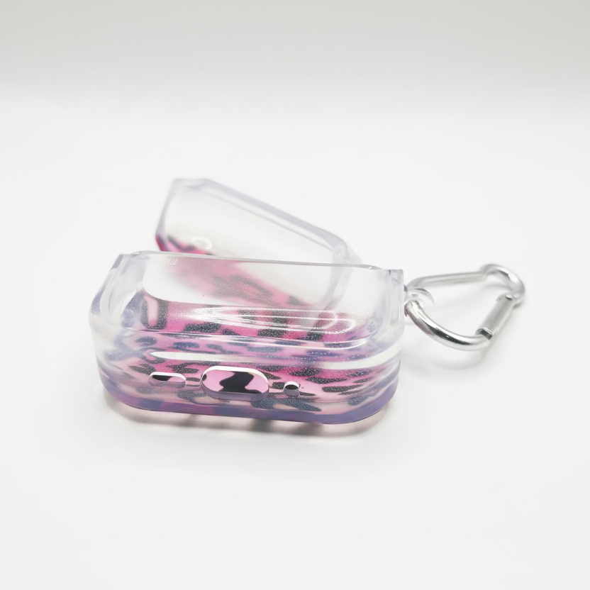 Clear case with pink and leopard print design and carabiner on a gray background