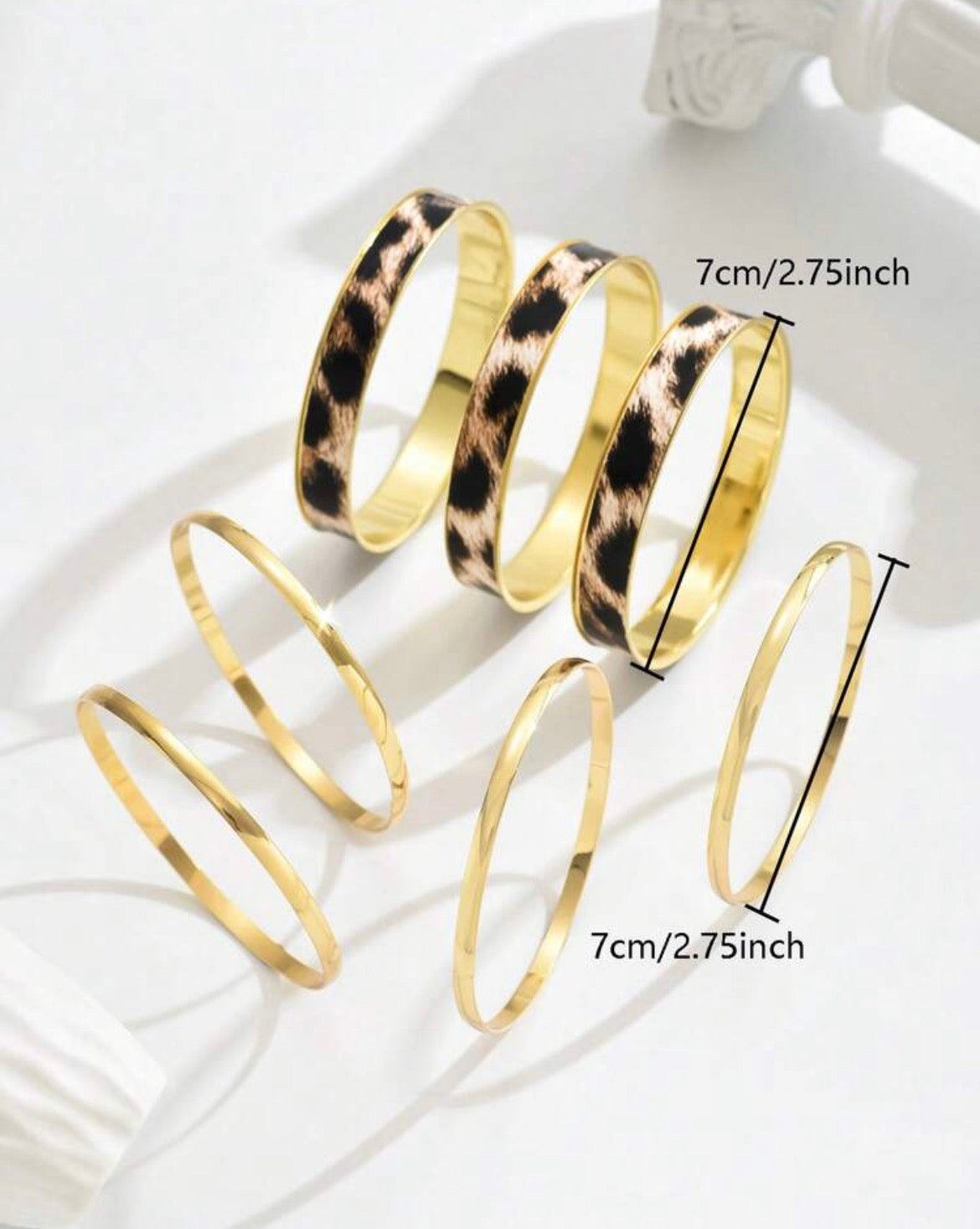Gold and leopard print headbands on a white background with measurements.