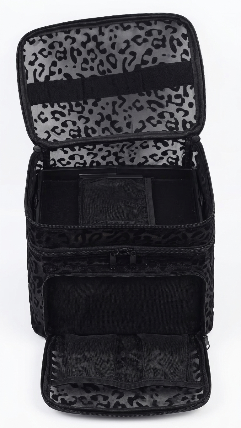 Black makeup bag with leopard print interior on a white background