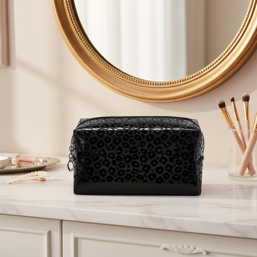 Black leopard print cosmetic bag on a white background