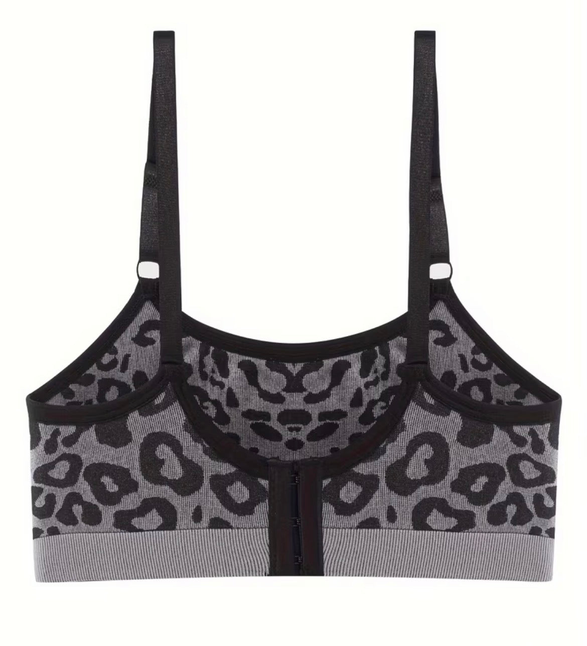 Leopard print sports bra with black straps on a white background