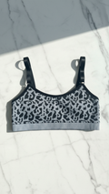 Leopard print sports bra on a marble surface