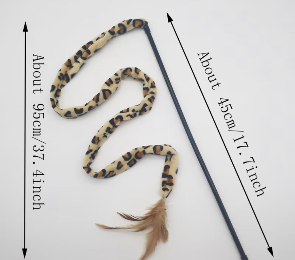 Leopard print cat toy with a measuring stick on a white background