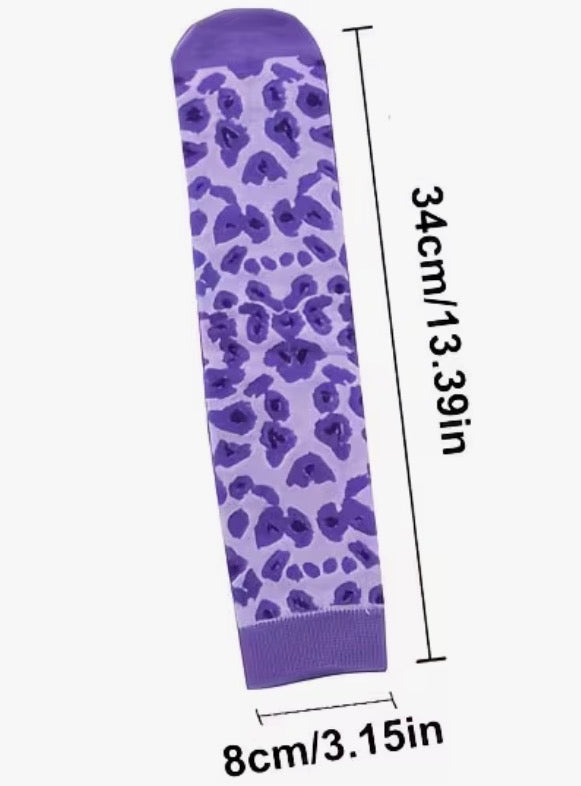 Purple knee-high sock with blue floral pattern and measurements on a white background