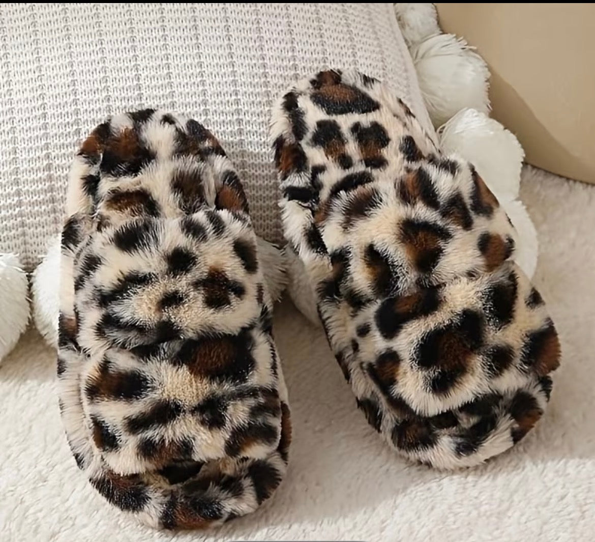 Leopard print slippers on a soft surface