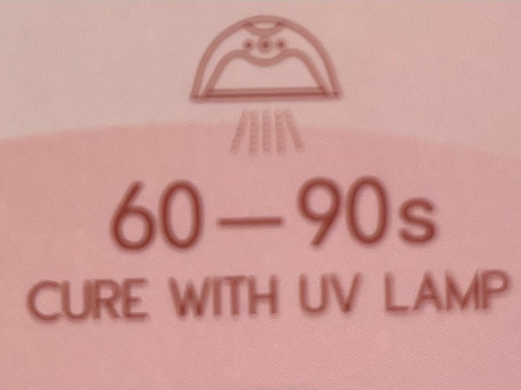 Text on a pink background indicating a cure time with UV lamp