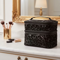 Black leopard print makeup bag on a vanity with makeup brushes and products.