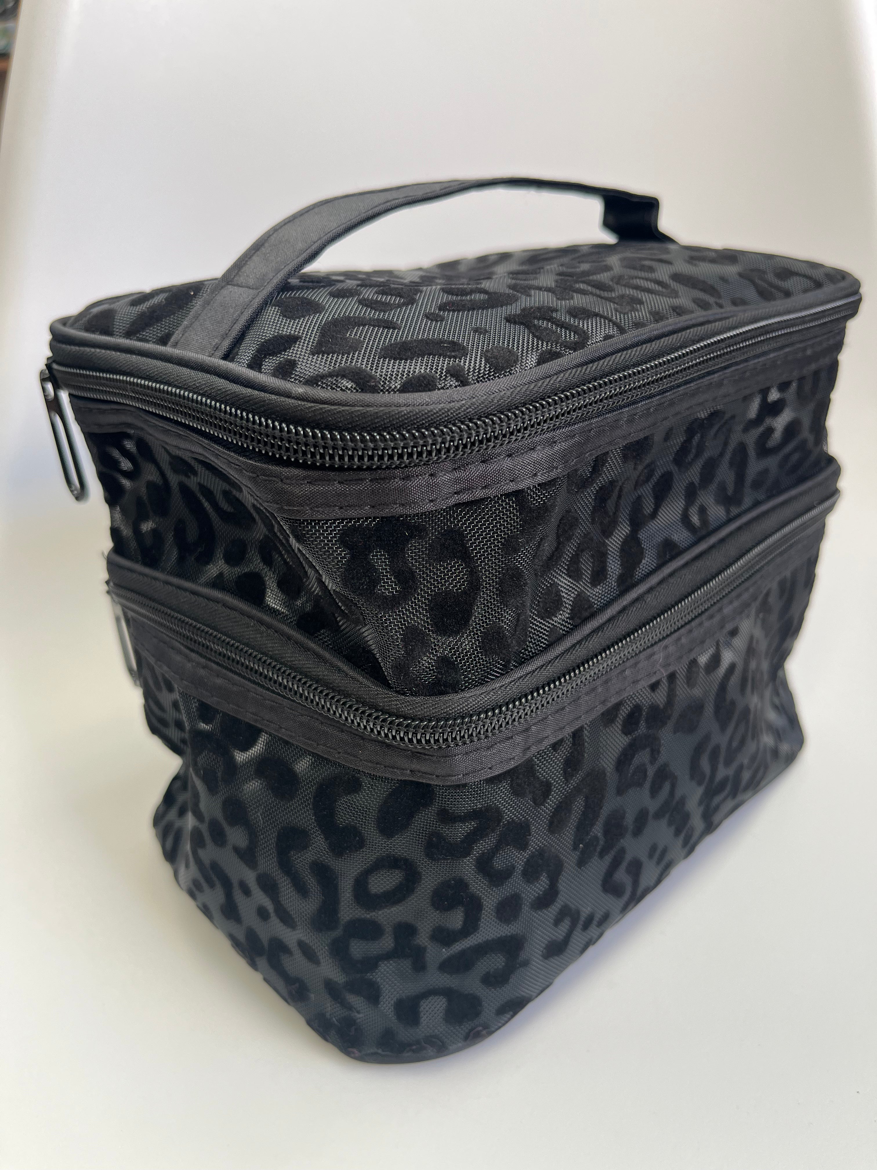 Black leopard print makeup bag on a white background