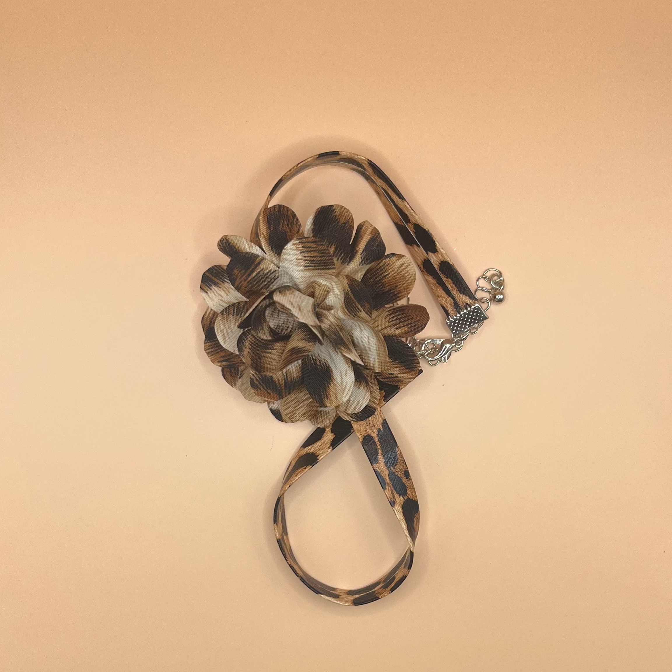 Leopard print chocker on a beige background