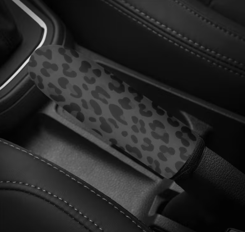 Car hand break with leopard print cover inside a vehicle