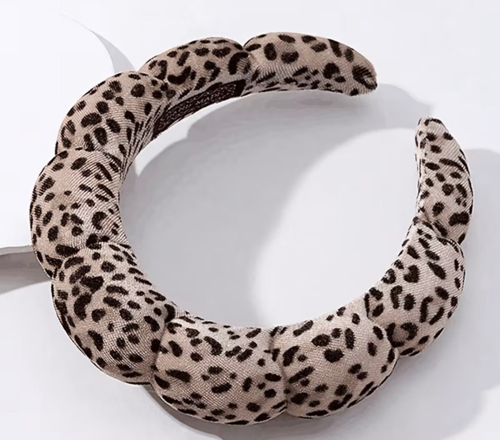 Leopard print headband on a white background