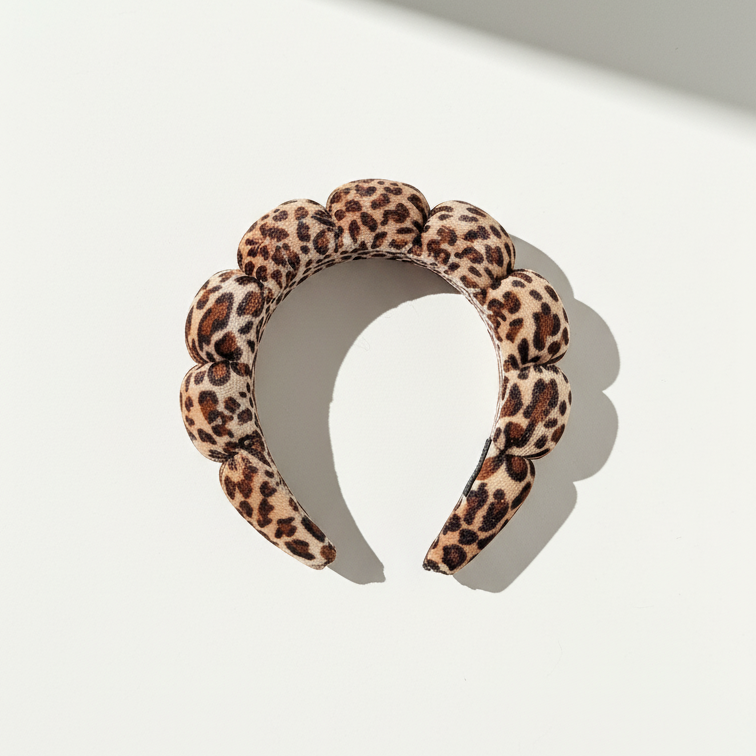 Leopard print headband on a light background