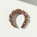 Leopard print headband on a light background
