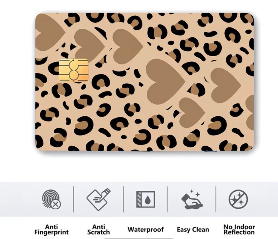 Card with leopard print design and gold chip on a beige background