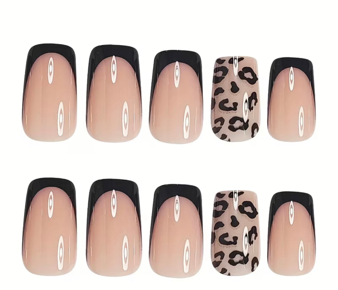 Set of false nails with beige, black, and leopard print designs on a white background