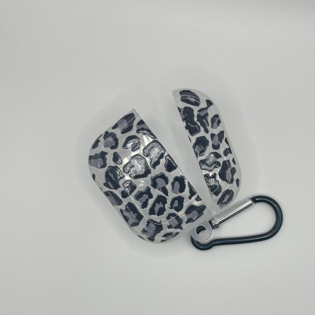 Leopard print case with carabiner on a light gray background