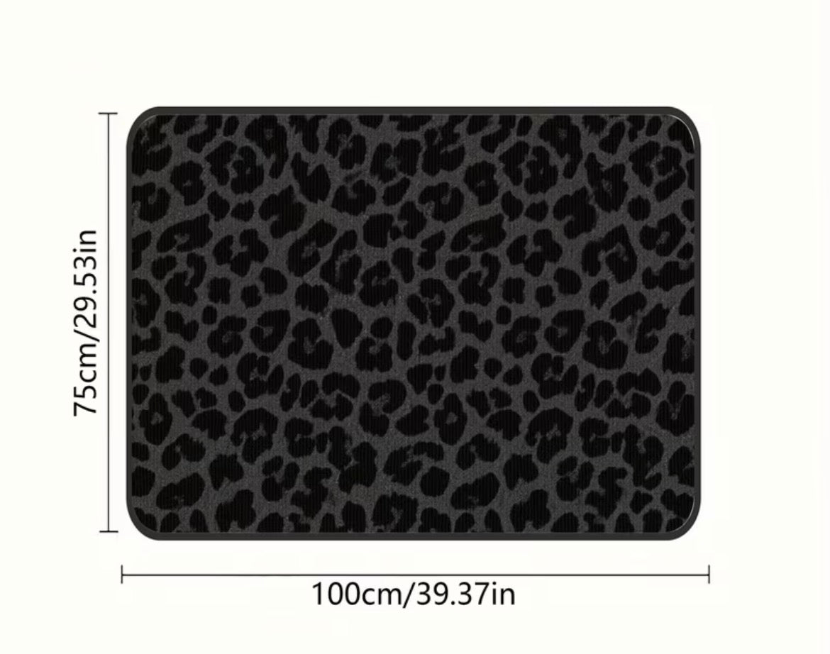 Black leopard print liner for car boot with measurements on a white background