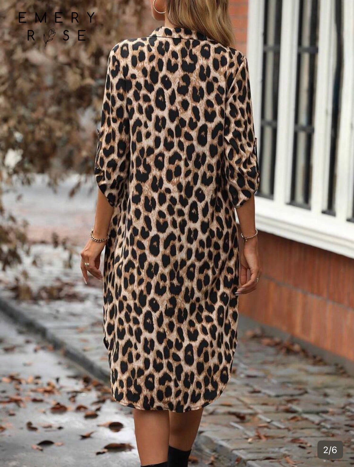 Person wearing a leopard print dress with 'Emery Rose' branding in the corner.