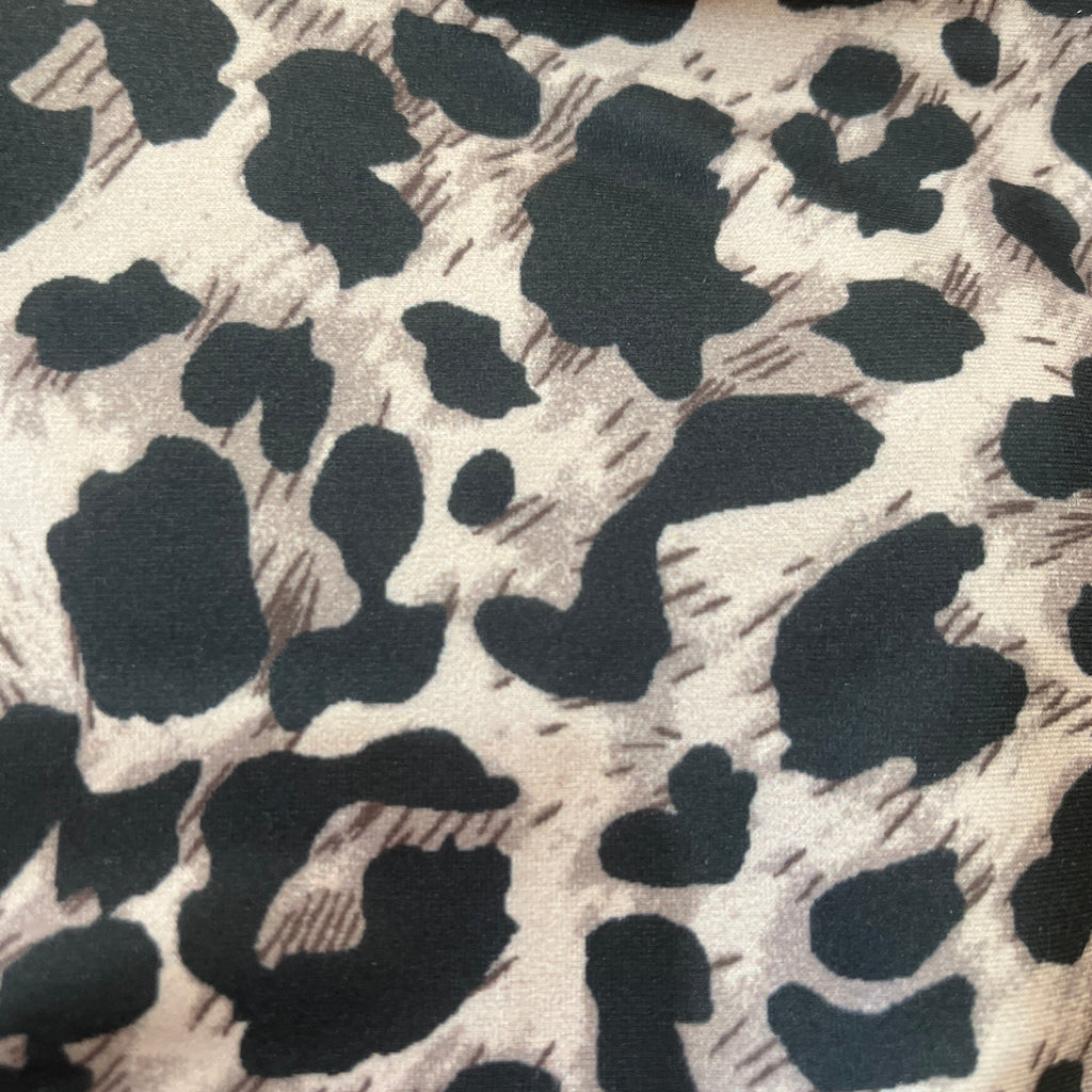 Close-up of fabric with black and white leopard print pattern