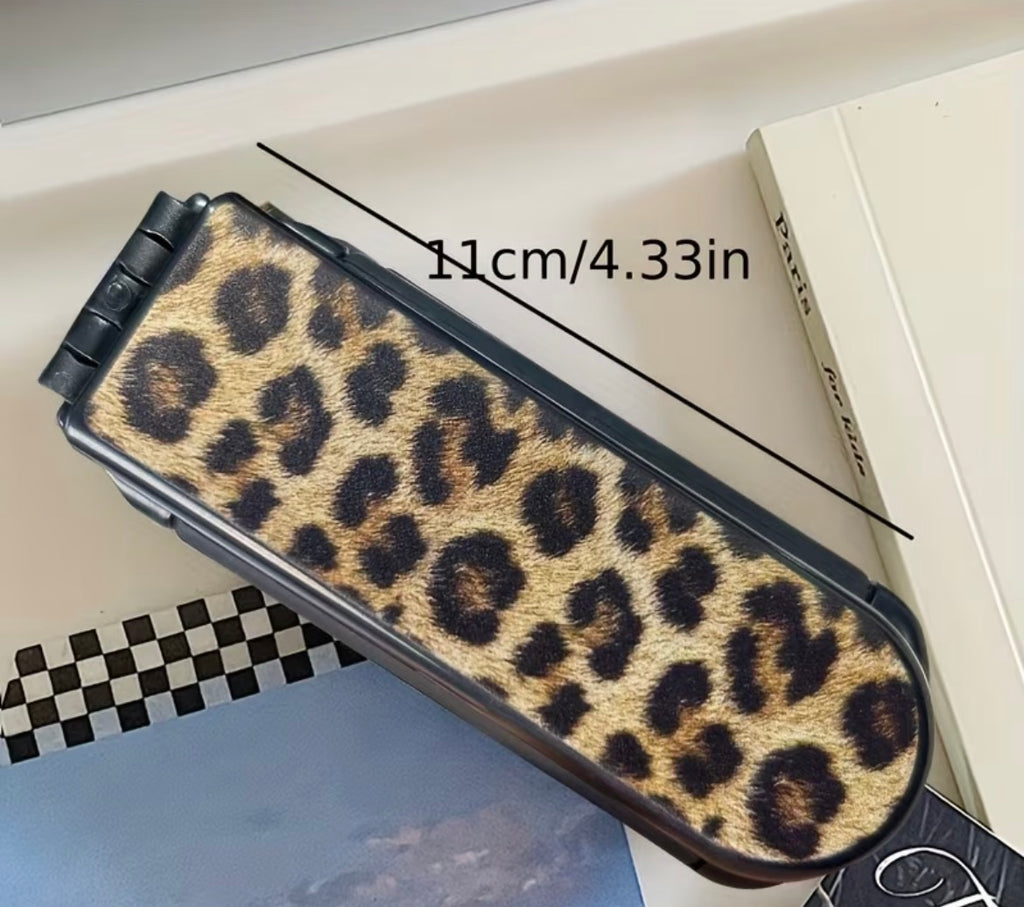 Leopard print case with dimensions on a checkered surface