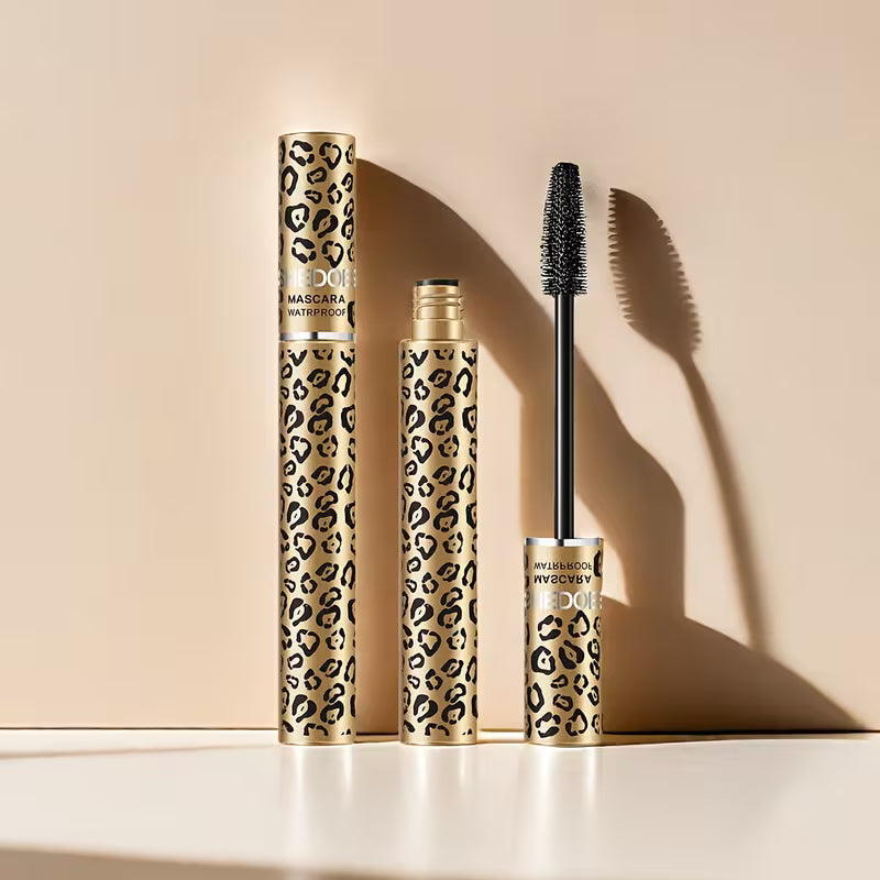 Mascara with leopard print design on beige background