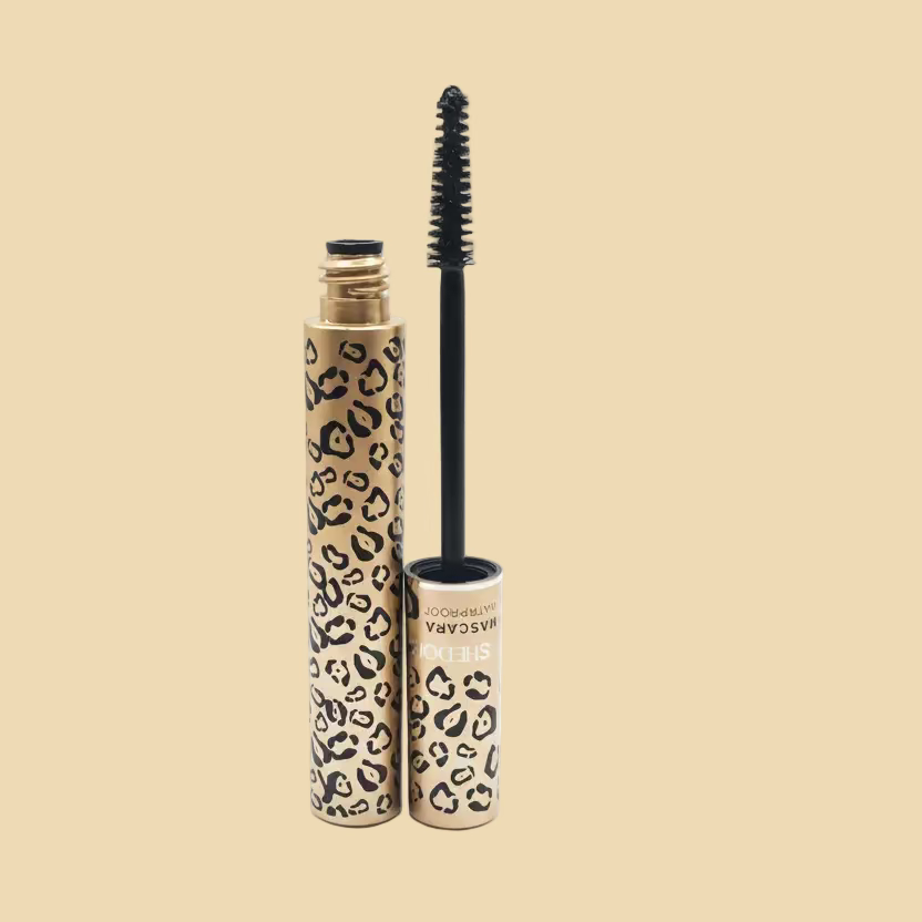 Mascara with leopard print design on beige background