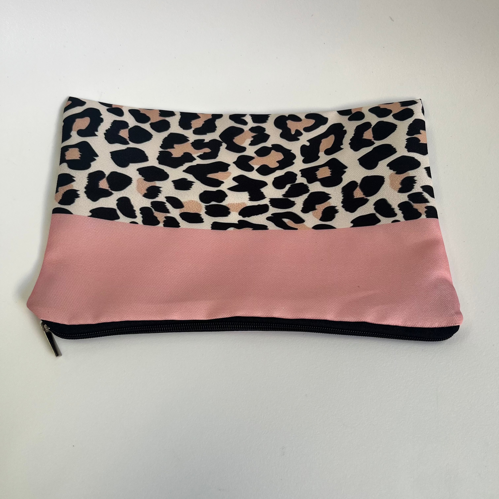 Pouch with leopard print top section and pink bottom section on a white background