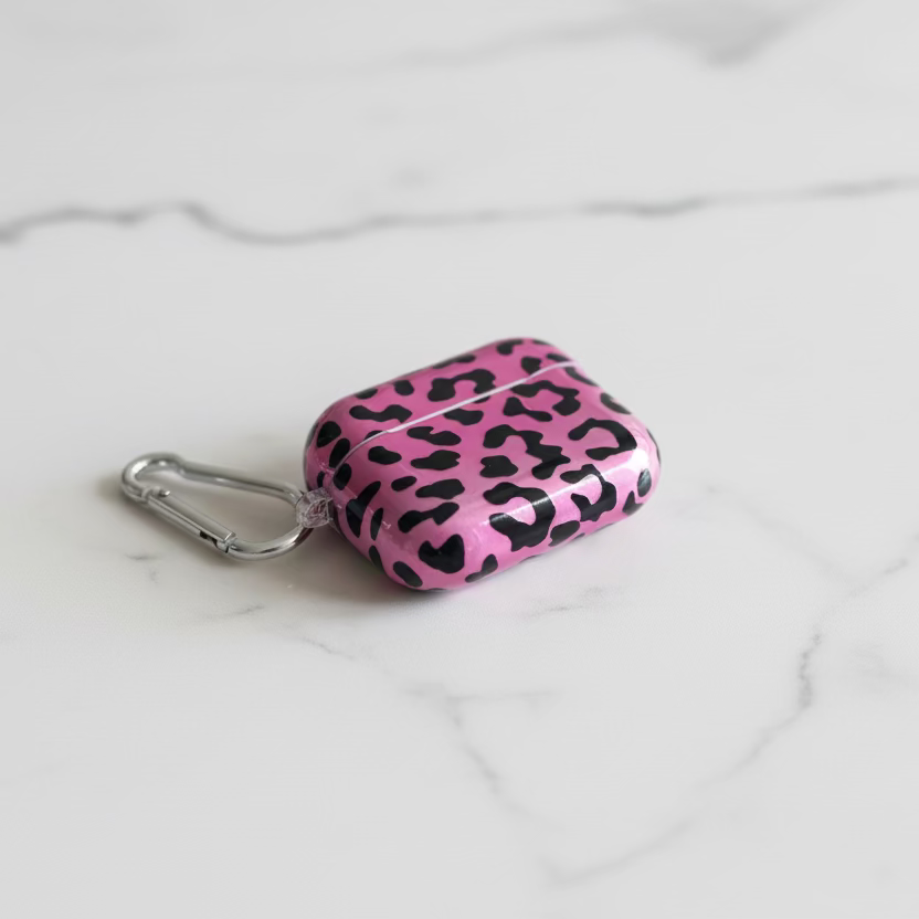 Pink leopard print case with carabiner on a white background