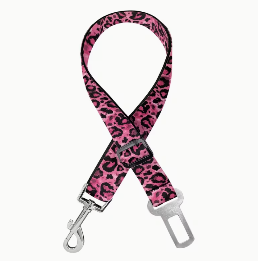 Pink leopard print dog seat beltwith silver clip on a white background